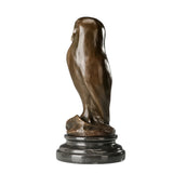 Rear view of minimalist bronze owl sculpture showing simple flowing silhouette