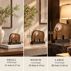 Small, medium and large minimalist elephant bronze sculptures shown together for size comparison