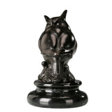 a modern abstract bronze owl sculpture with smooth minimalist lines and a black marble base. A stylish symbol of wisdom, perfect for contemporary home or office decor.