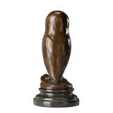 Rear view of modern bronze owl sculpture showing simple flowing silhouette