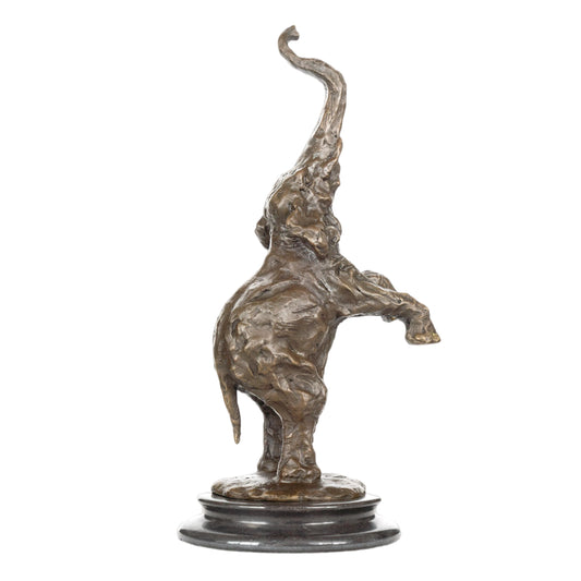 Expressive modern elephant calf bronze sculpture with raised trunk and textured finish. A playful wildlife art piece for modern home or office decor.