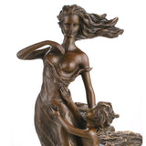 Close-up detail of mother and child bronze sculpture with hand-applied bronze patina