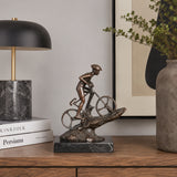 Mountain Biker Bronze Sculpture displayed in a modern interior