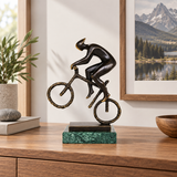 Abstract bronze mountain biker statue displayed as modern cycling, sports, and office decor