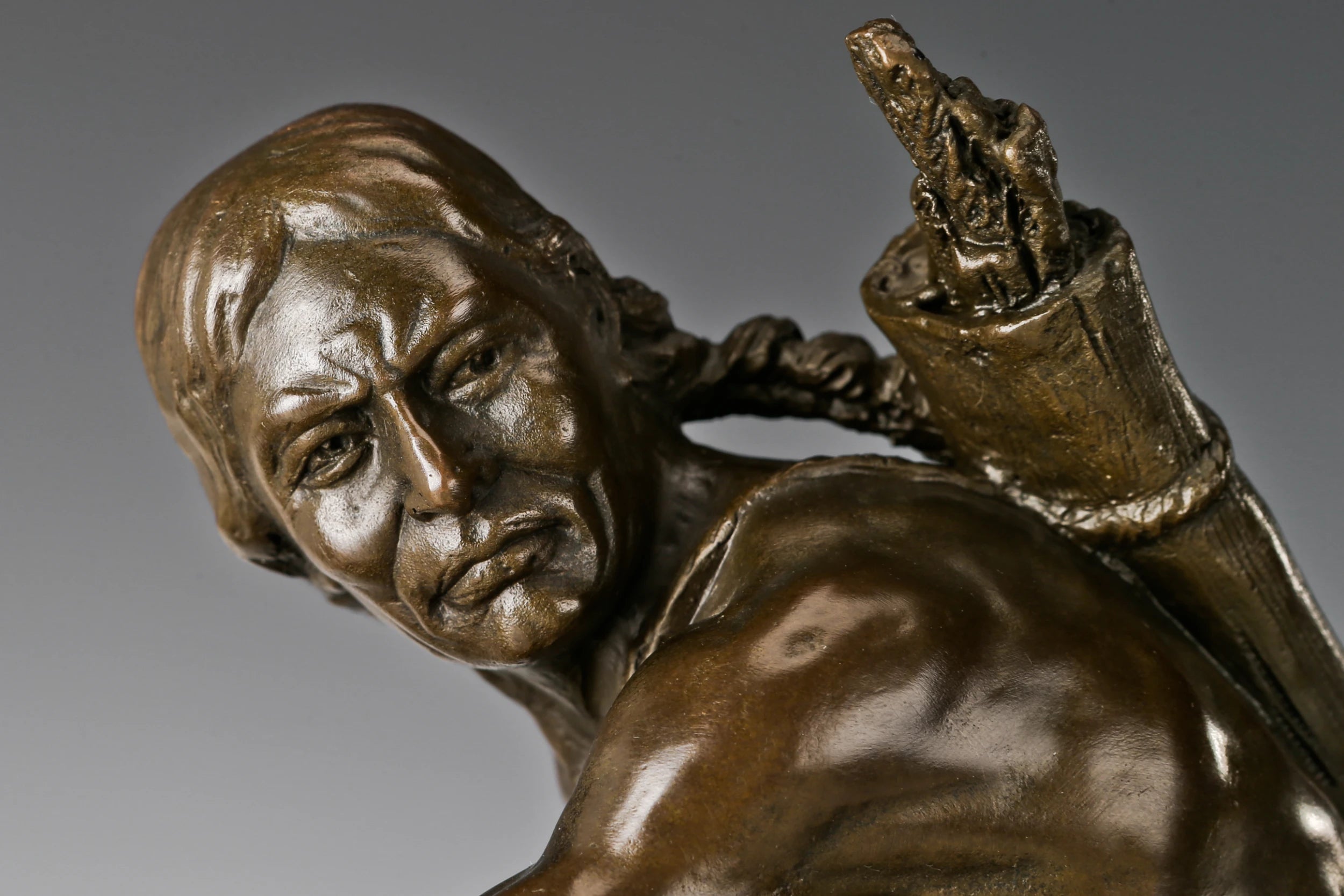 Close-up of the Native American rider showing expressive pose and handcrafted bronze detail