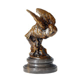 A bronze owl statue capturing the powerful moment of flight. Detailed feather textures and a black marble base make this wildlife statue perfect for home or office decor.