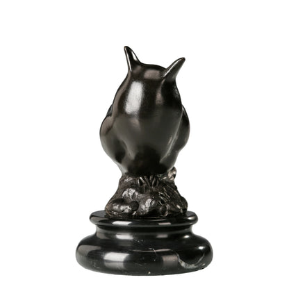 a modern abstract bronze owl sculpture with smooth minimalist lines and a black marble base. A stylish symbol of wisdom, perfect for contemporary home or office decor.