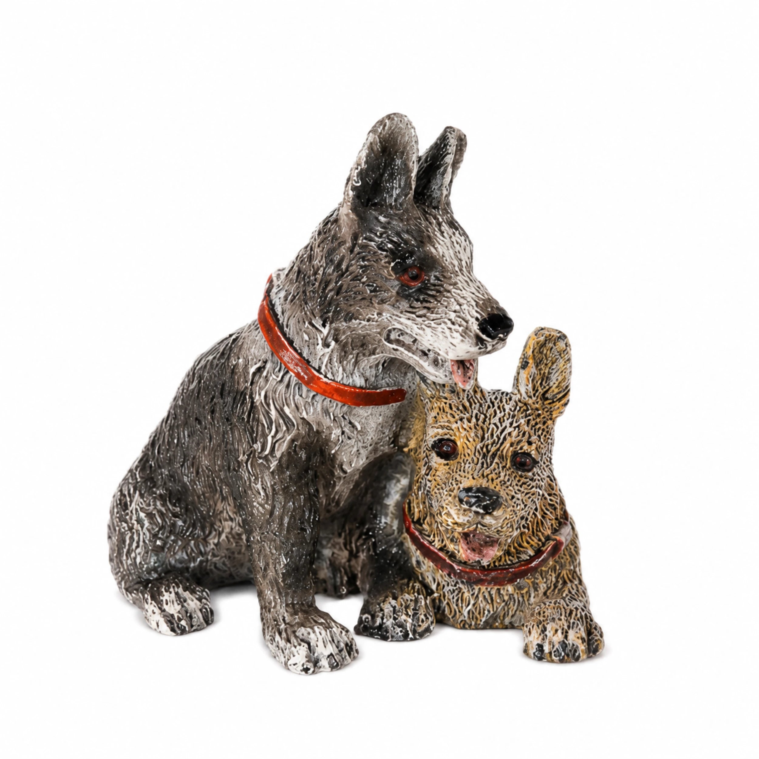 Close-up of painted bronze hunting dog group showing different poses and hand-finished coat colors