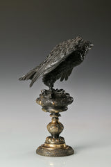 Elegant bronze eagle sculpture with ornate pedestal and detailed feathers. A refined statement piece symbolizing strength, control, and authority.