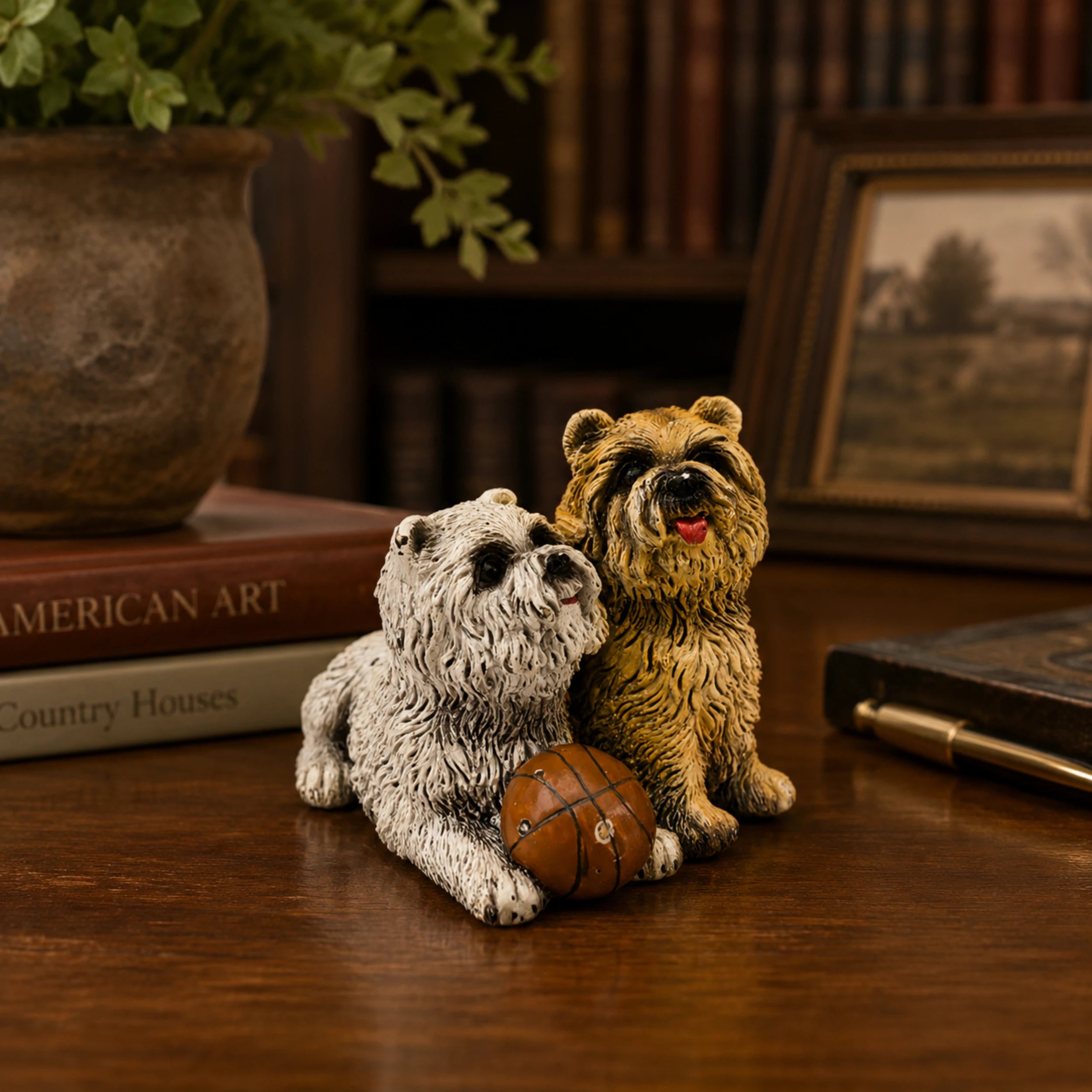 Playful bronze puppy pair sculpture with ball displayed as cheerful home and shelf decor