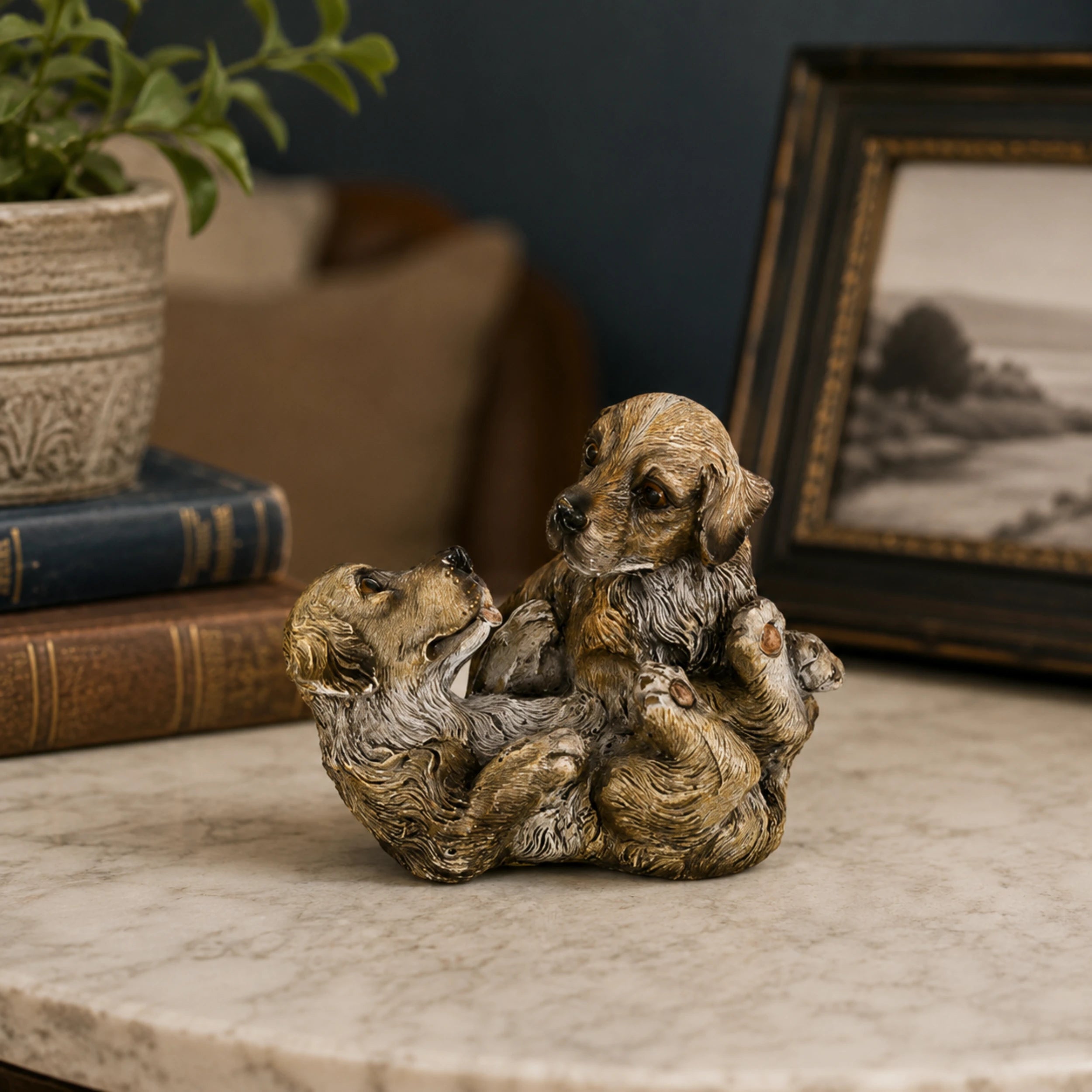 Playful Bronze Puppy Pile Bronze Sculpture displayed in a styled interior