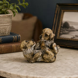 Playful Bronze Puppy Pile Bronze Sculpture displayed in a styled interior