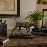 Pointing Hunting Dog Bronze Sculpture displayed in a styled interior