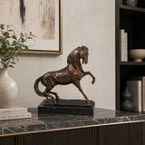 Refined prancing bronze horse sculpture with raised foreleg and flowing mane, realistic equestrian statue on black marble base, lost wax casting fine art.