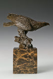 Pre-flight bronze eagle sculpture with detailed feathers and natural base. Elegant wildlife statue for home decor, office, or collectors.