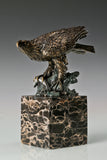 Pre-flight bronze eagle sculpture with detailed feathers and natural base. Elegant wildlife statue for home decor, office, or collectors.