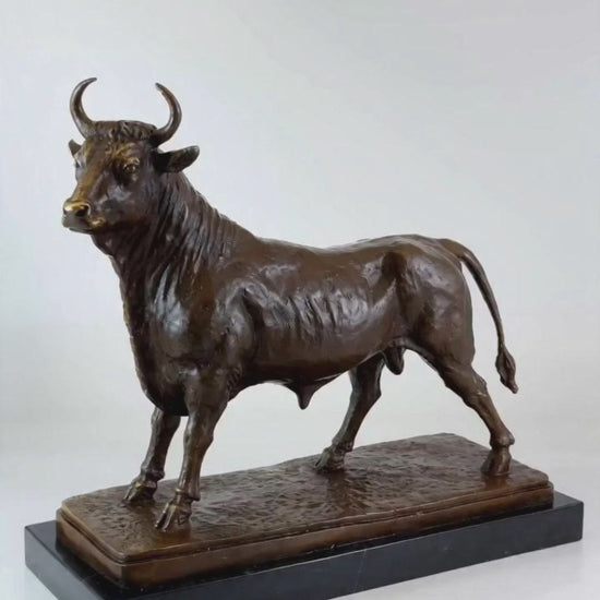 A classical hand-finished bronze standing bull sculpture with a rich brown patina, captured in a powerful stance and mounted on a premium polished black marble base for high-end home and office desktop decoration.