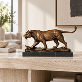 Prowling Lioness Bronze Sculpture displayed in a minimalist interior