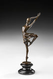 Left side view of bronze ballerina sculpture balancing with one bent leg raised
