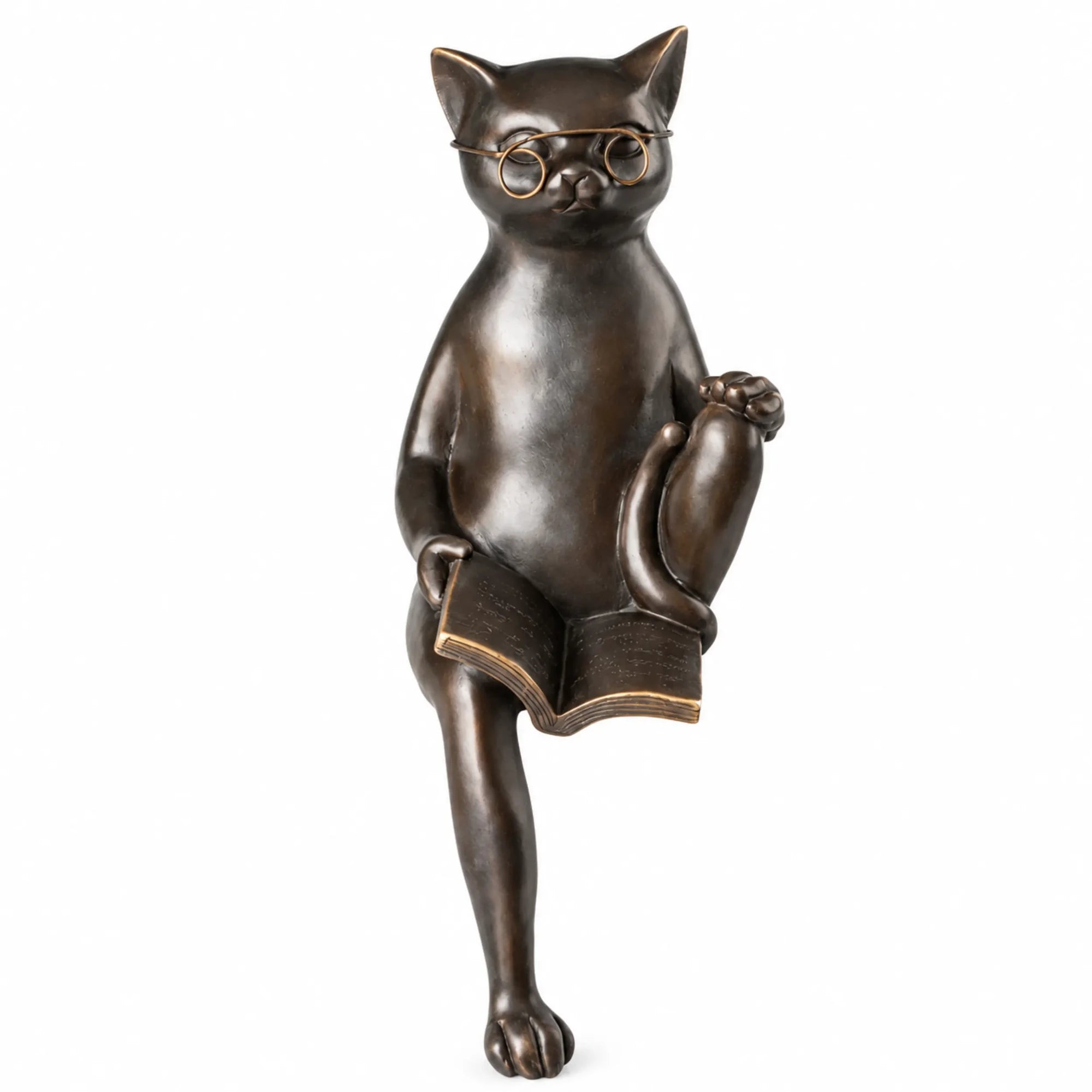 Front view of bronze reading cat sculpture wearing glasses and holding an open book
