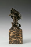 Pre-flight bronze eagle sculpture with detailed feathers and natural base. Elegant wildlife statue for home decor, office, or collectors.