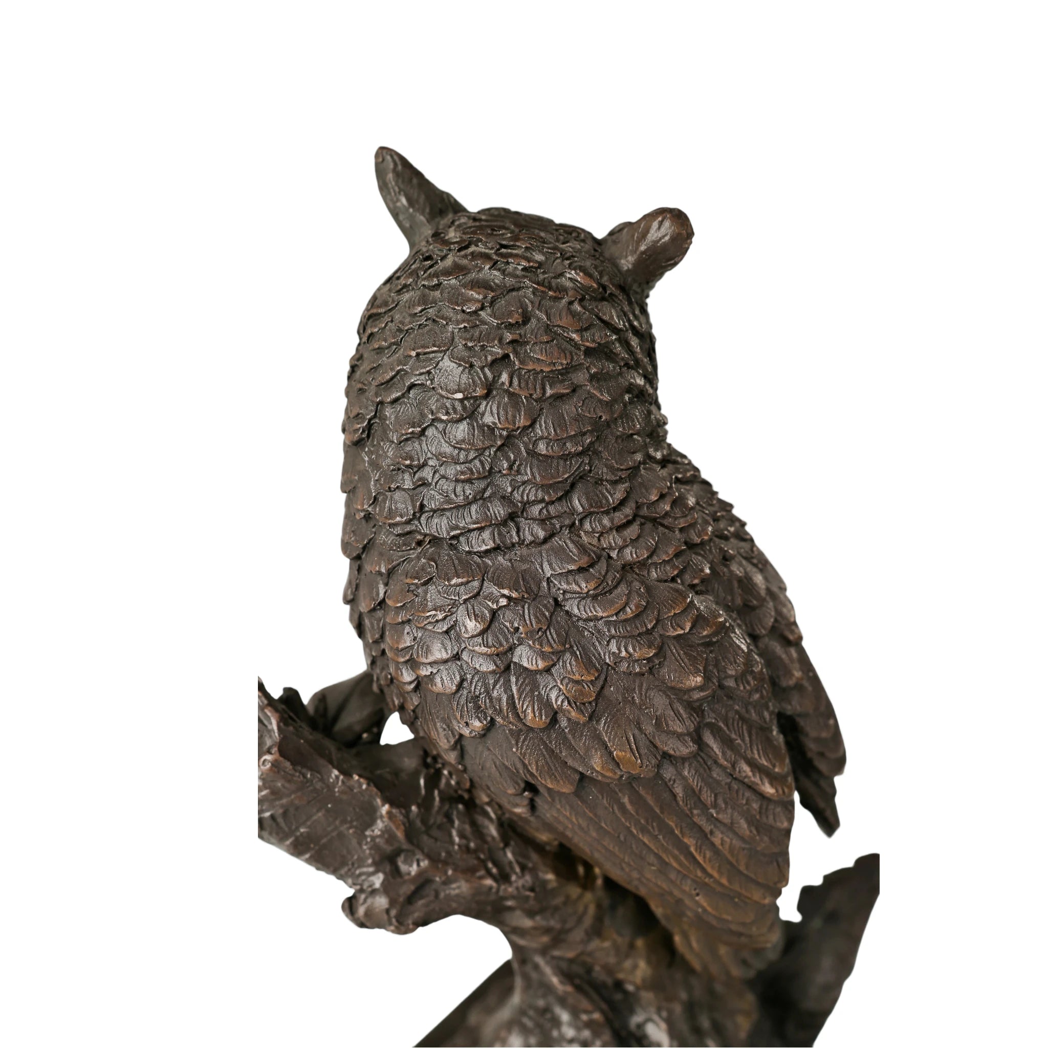 Rear view of realistic bronze owl sculpture showing layered wing and feather details