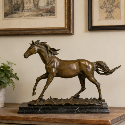 Dynamic galloping bronze horse sculpture with flowing mane and tail, realistic running horse statue on veined black marble base, loss wax casting fine art.