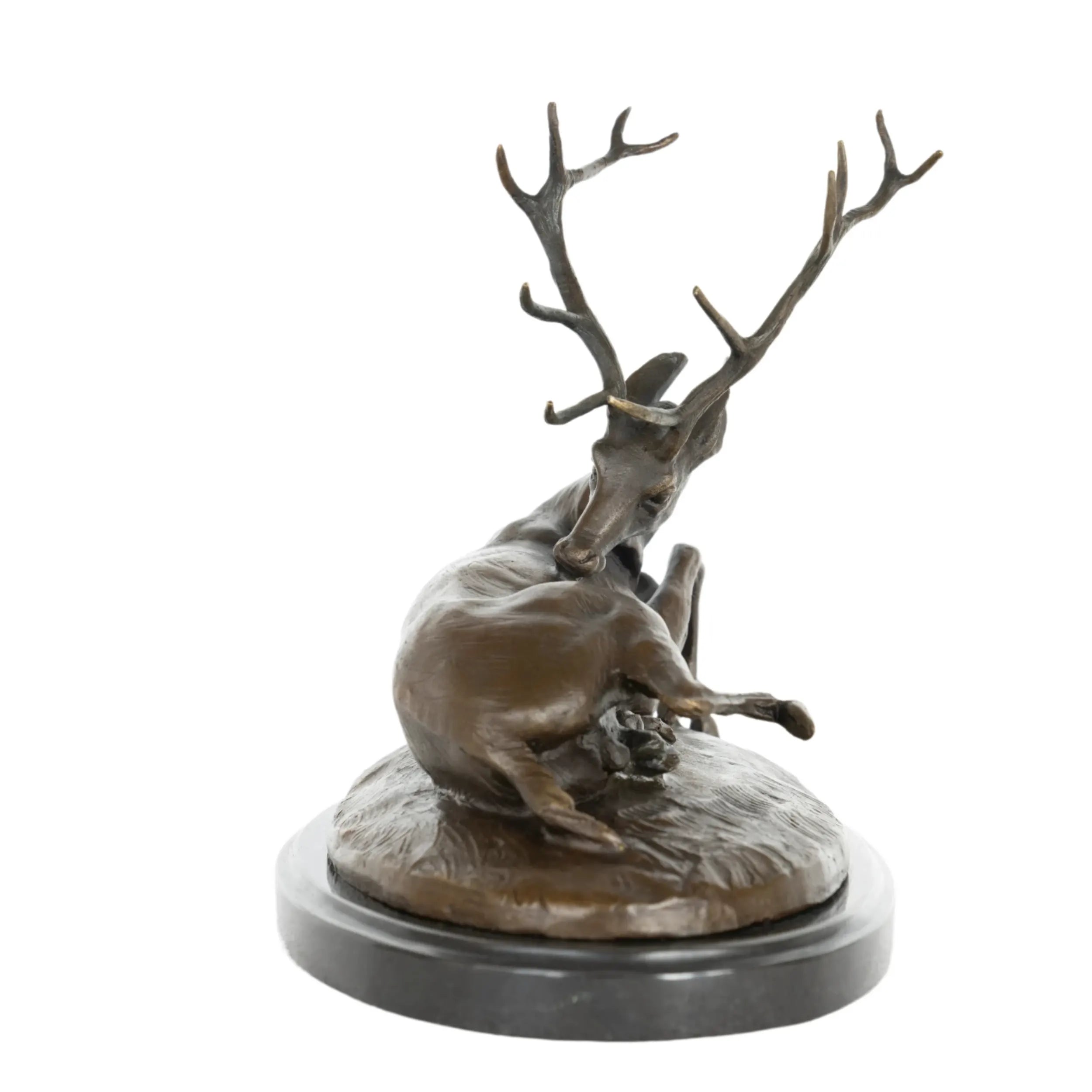 Front view of handcrafted reclining bronze deer sculpture with detailed branching antlers