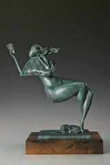 Side view of a reclining bronze woman holding a book with a small dog resting beneath her feet
