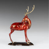 Handcrafted red bronze Christmas reindeer sculpture with elegant golden antlers