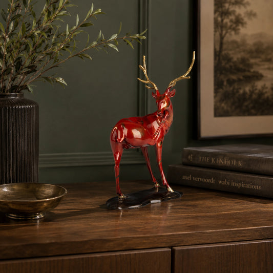 Red bronze reindeer sculpture displayed as elegant Christmas mantel and holiday home decor