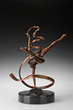 Bronze ribbon ballet dancer sculpture viewed from the opposite side showing the curved ribbon