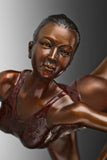 Close-up of female ballet ribbon dancer bronze sculpture showing her facial expression