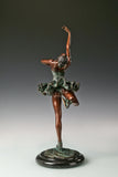 Back view of roller skating ballerina bronze sculpture showing the flowing skirt