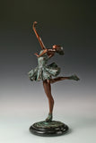 Left side view of roller skating ballerina bronze sculpture with one leg lifted behind