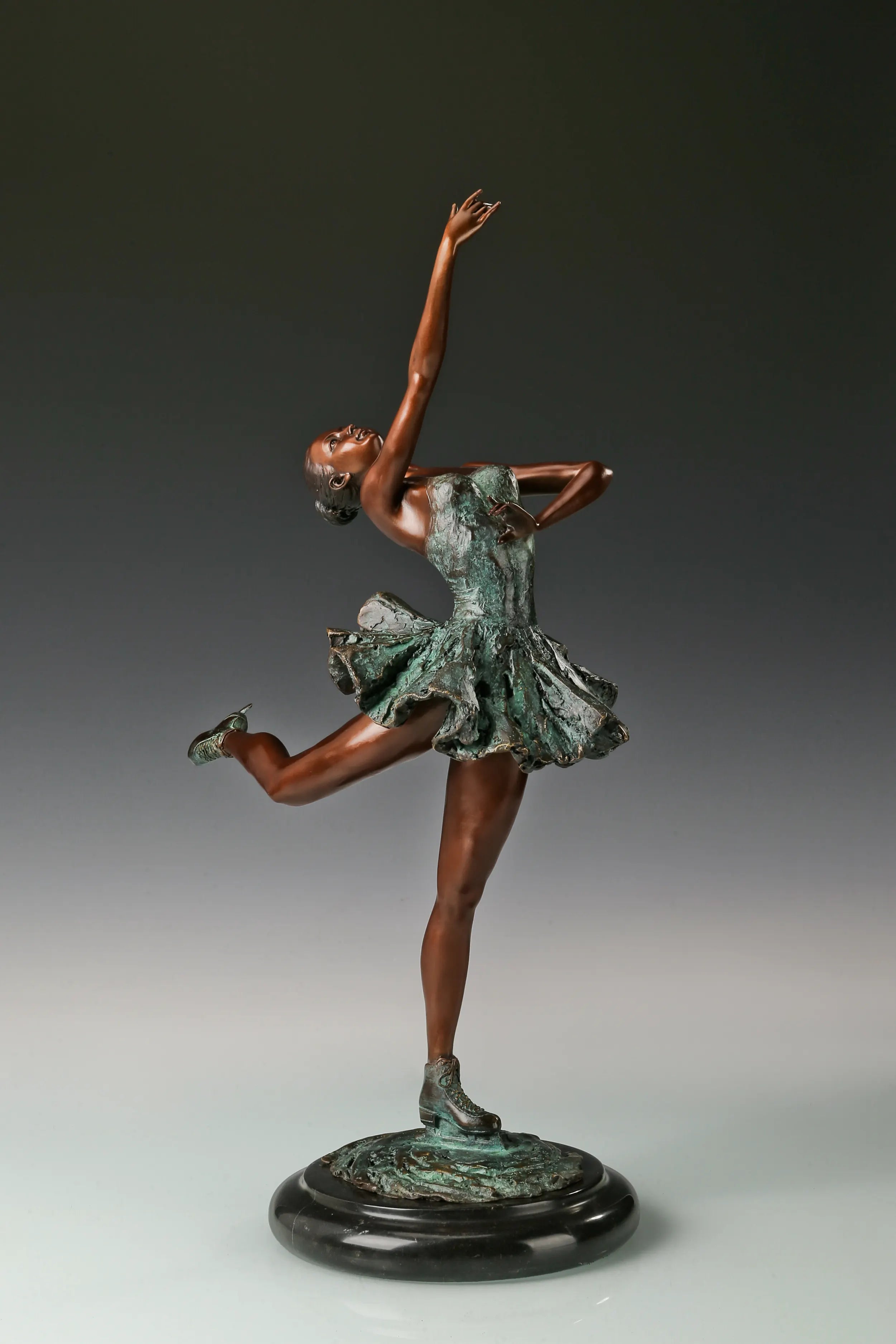 Three-quarter view of handcrafted roller skating ballerina bronze statue