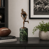 Running Back Football Bronze Sculpture displayed in a modern interior