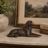 Small bronze lying dog sculpture displayed as charming desk, shelf, and home decor