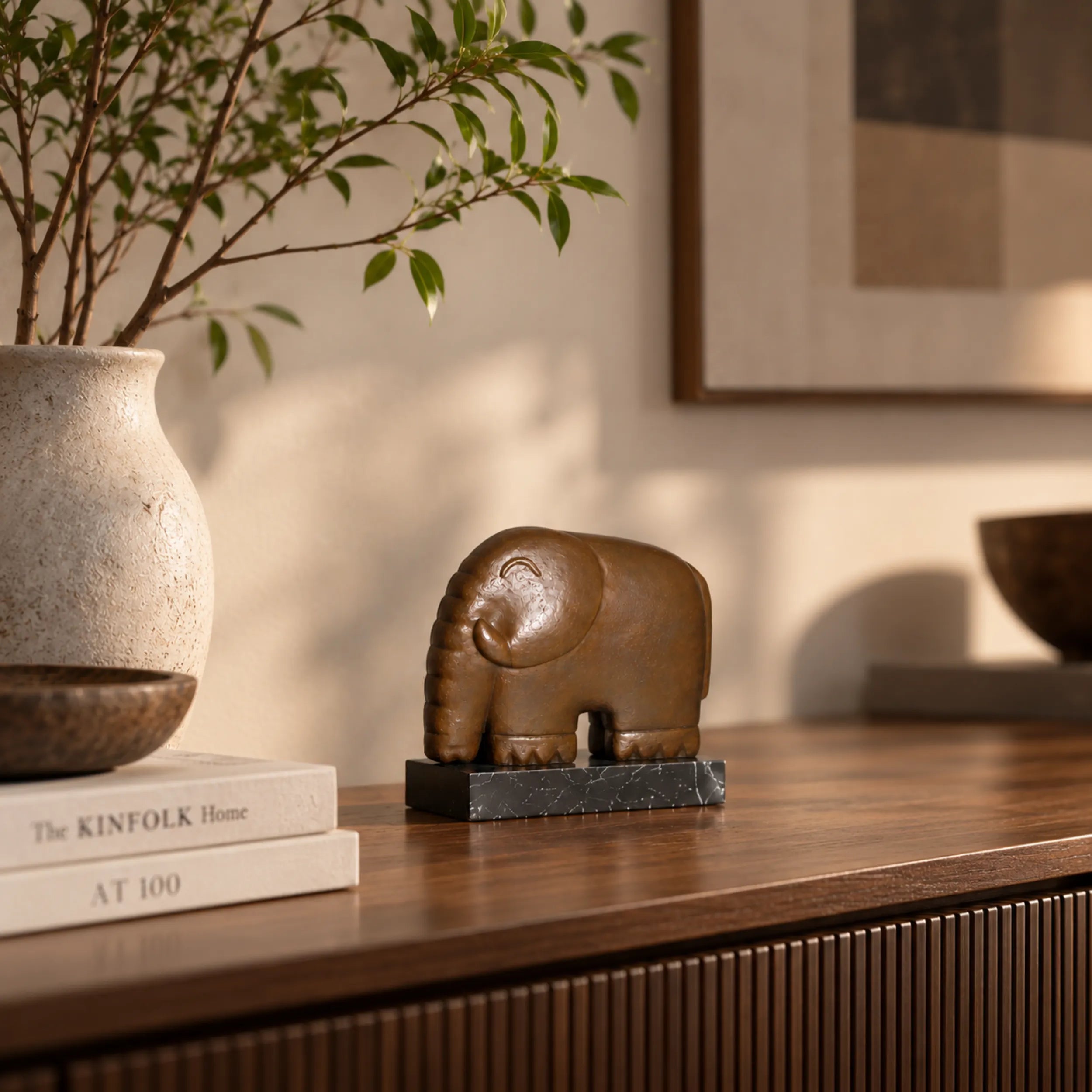 Small minimalist elephant bronze sculpture with rounded form