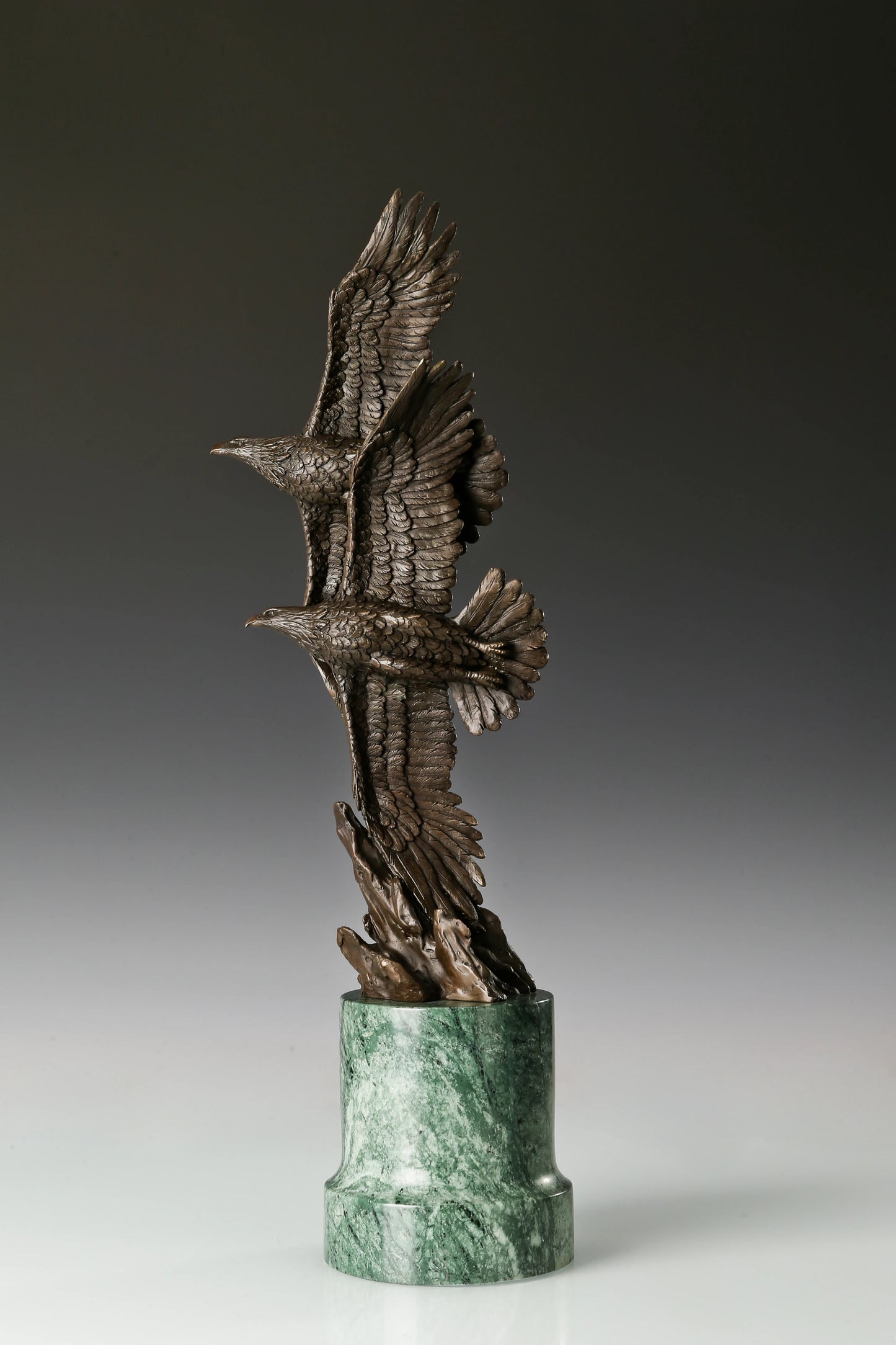 Two eagles soaring bronze sculpture with detailed feathers and marble base. Elegant wildlife statue for home decor, office, or collectors.