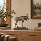 Standing Moose bronze sculpture displayed in a minimalist interior