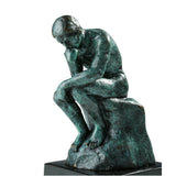 Close-up of the expressive face on the Rodin-inspired Thinker bronze statue