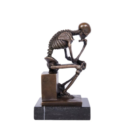thinking pose skull statue 