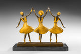 Back view of handcrafted three ballerinas bronze sculpture showing the dancers' costumes