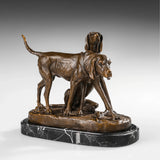 Angled view of two sporting dogs bronze sculpture showing contrasting standing and seated poses