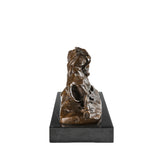 Bronze statue of two bulls fighting with dynamic movement and detailed musculature