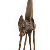 this bronze elephant on stilts sculpture features elongated legs and an obelisk motif. A striking surrealist art piece for collectors and modern interiors.