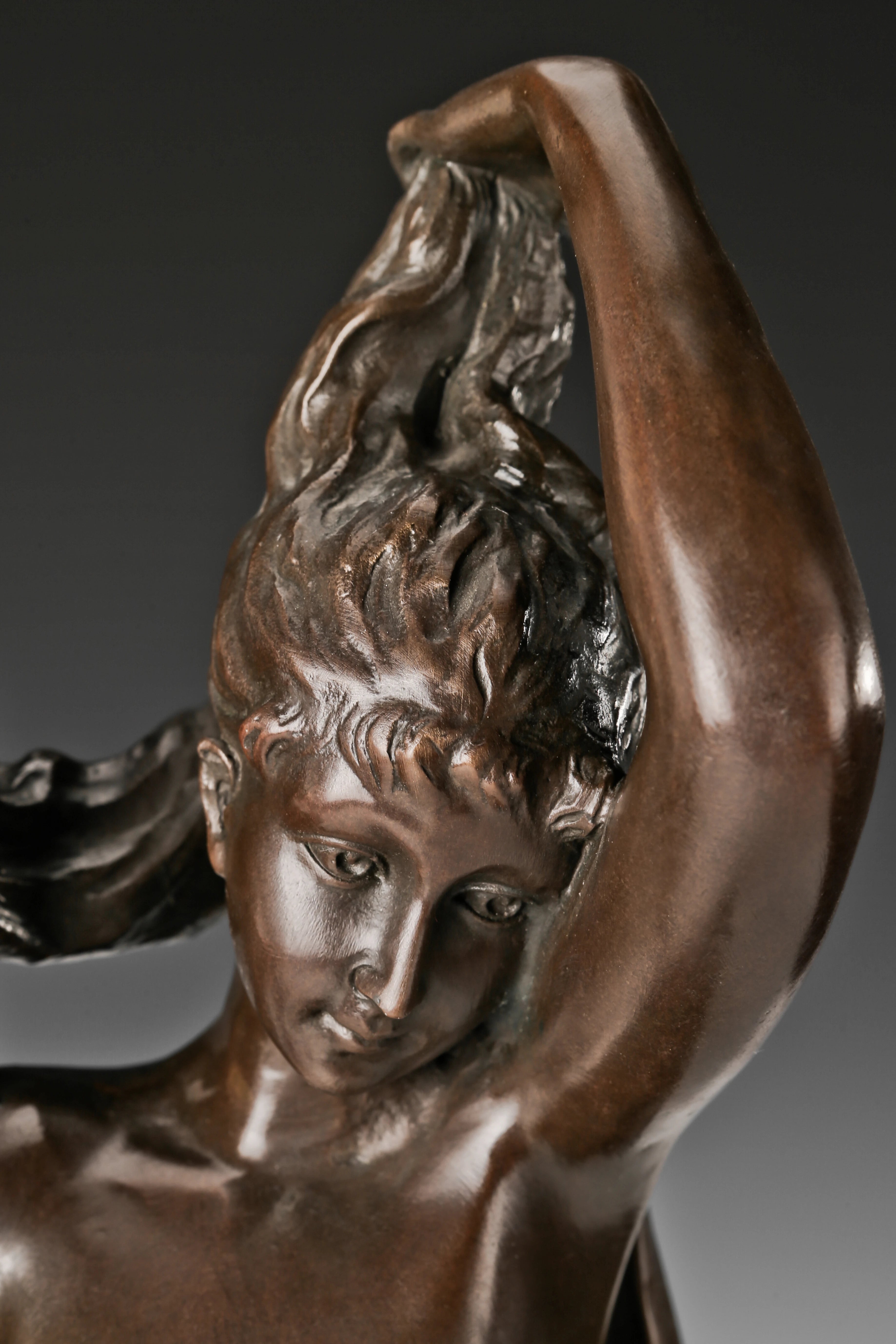Close-up of Venus bronze sculpture showing facial features hair and classical craftsmanship