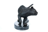 Front view of realistic walking cat bronze sculpture