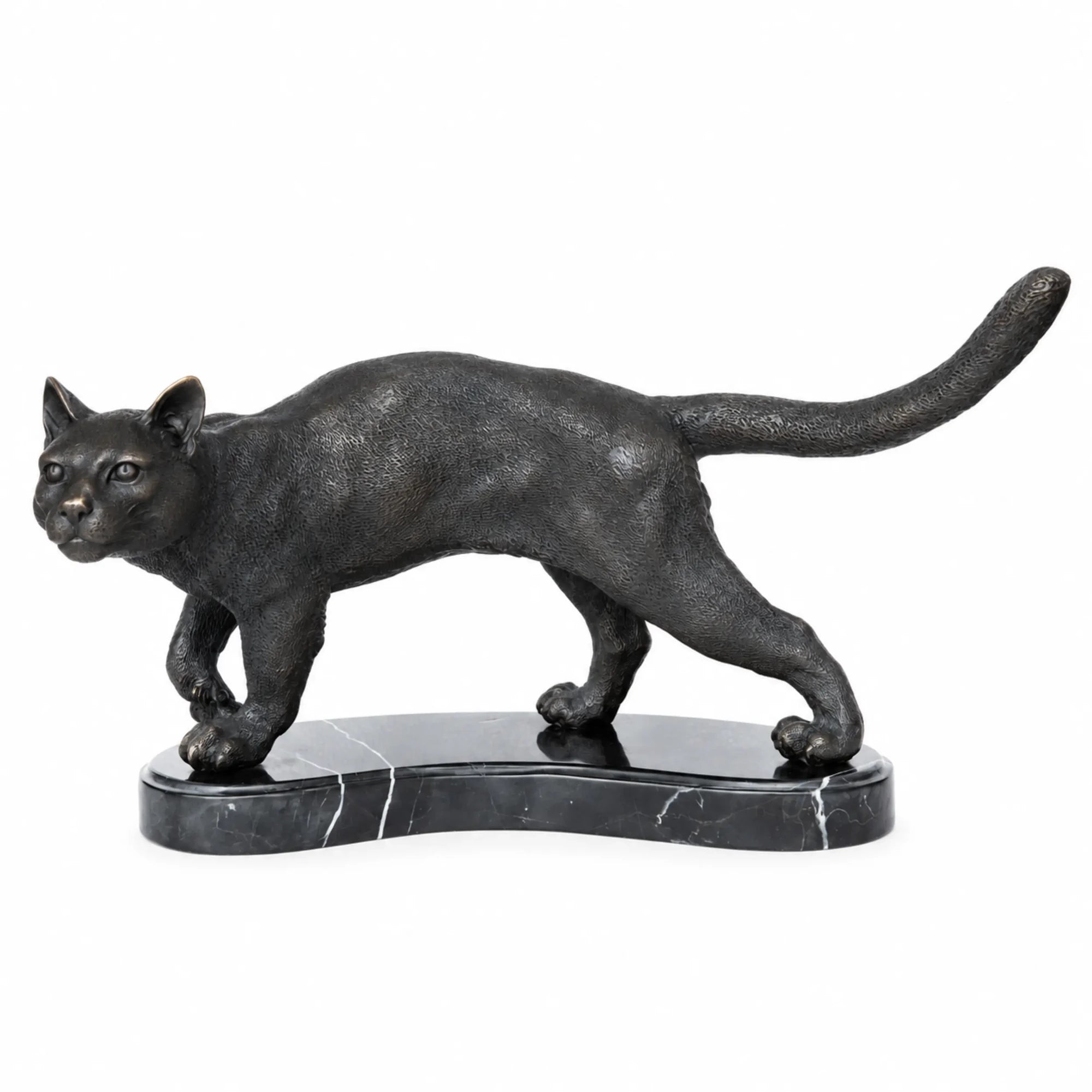 Left side view of walking cat bronze statue on marble base